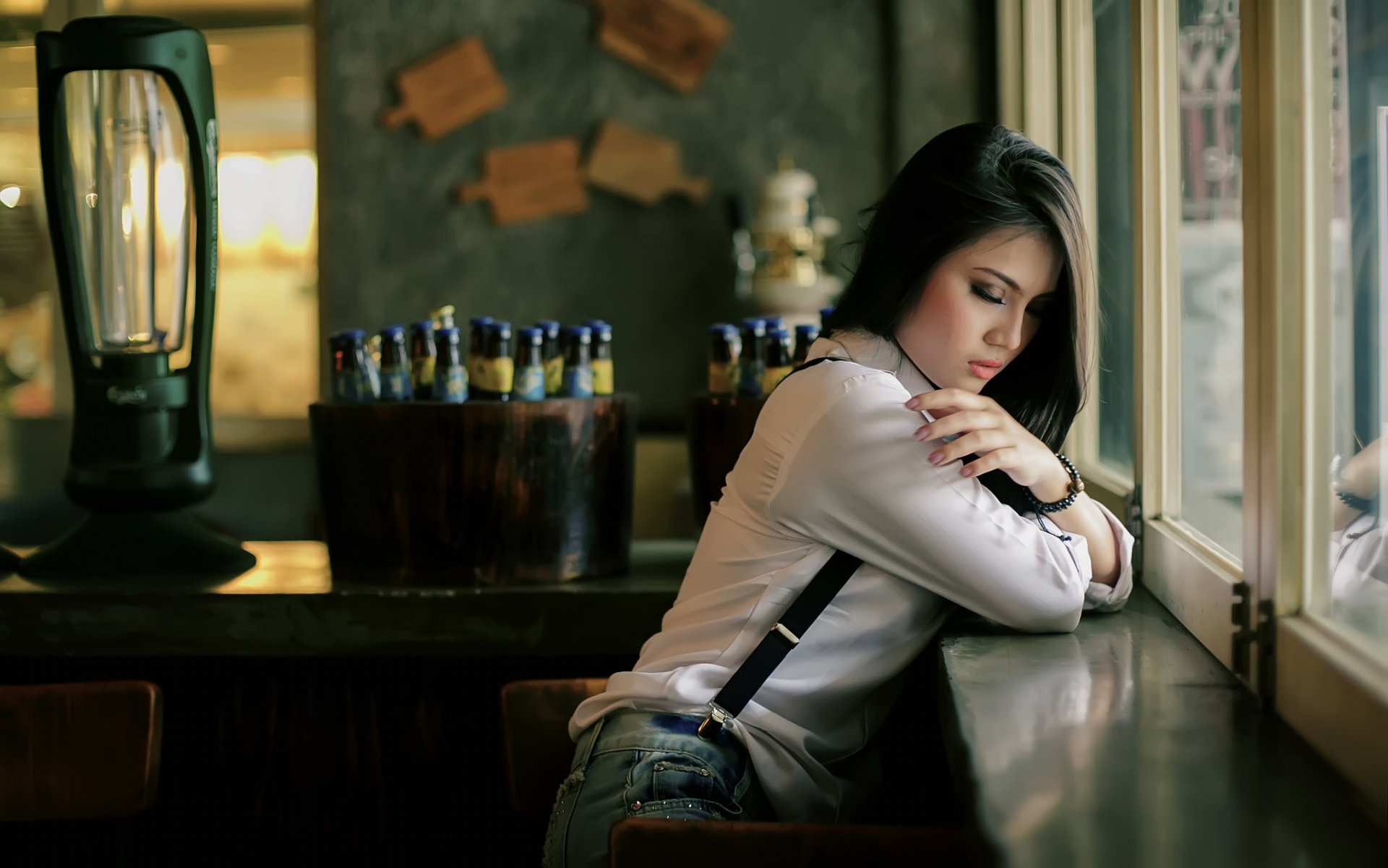girl in the cafe window of the bottle jacket