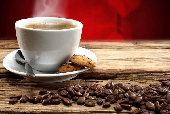 A cup of coffee with cookies. coffee seeds