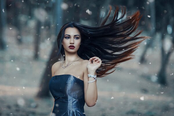A girl in the forest with developing hair
