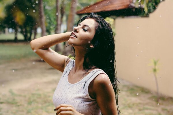 Brunette in the summer rain