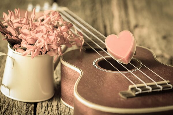 Gitarre und Blumen im romantischen Stil