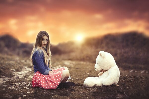 A girl with a teddy bear