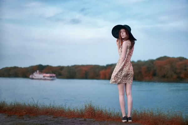 A beautiful girl stands on the threshold of the prechala