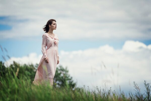 Lilia Savoderova in a field above a beautiful sky. Gone with the Wind