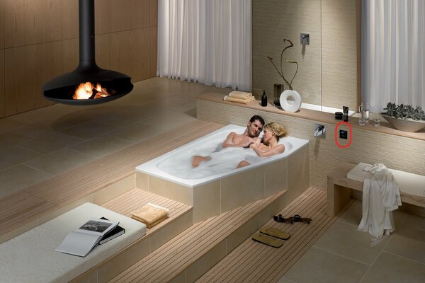 A young couple takes a bath together