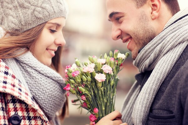 A girl and a guy are a beautiful couple with a smile