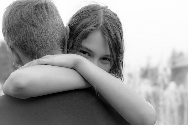 Happy girl hugs a guy