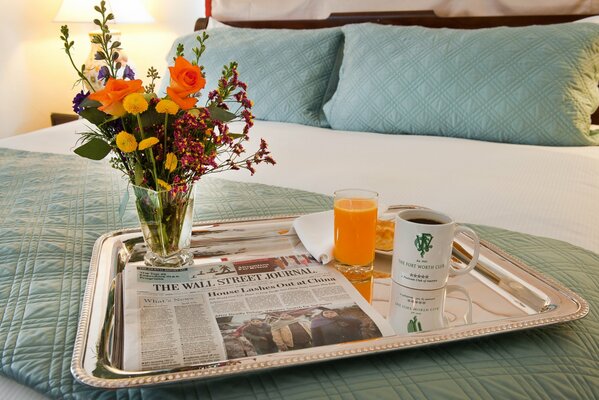 Coffee in bed with flowers