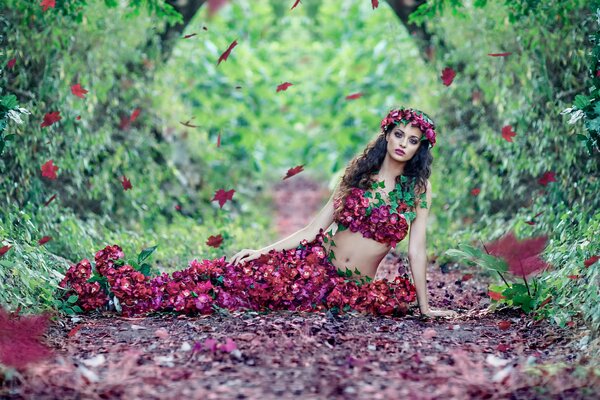 Autumn photo shoot in leaves. Flower Girl