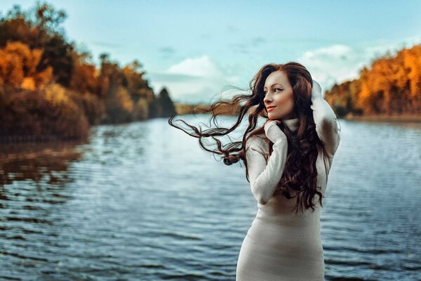 Autumn portrait of a girl in the wind