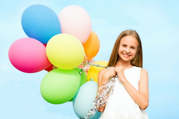Happy girl with balloons