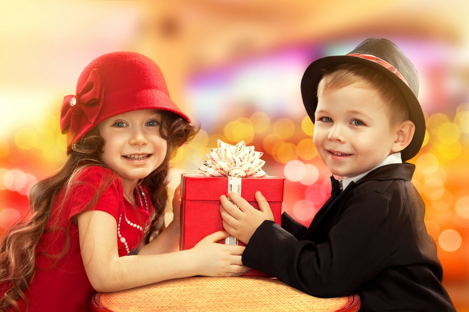 children boys girl present greeting holiday mood smile hat