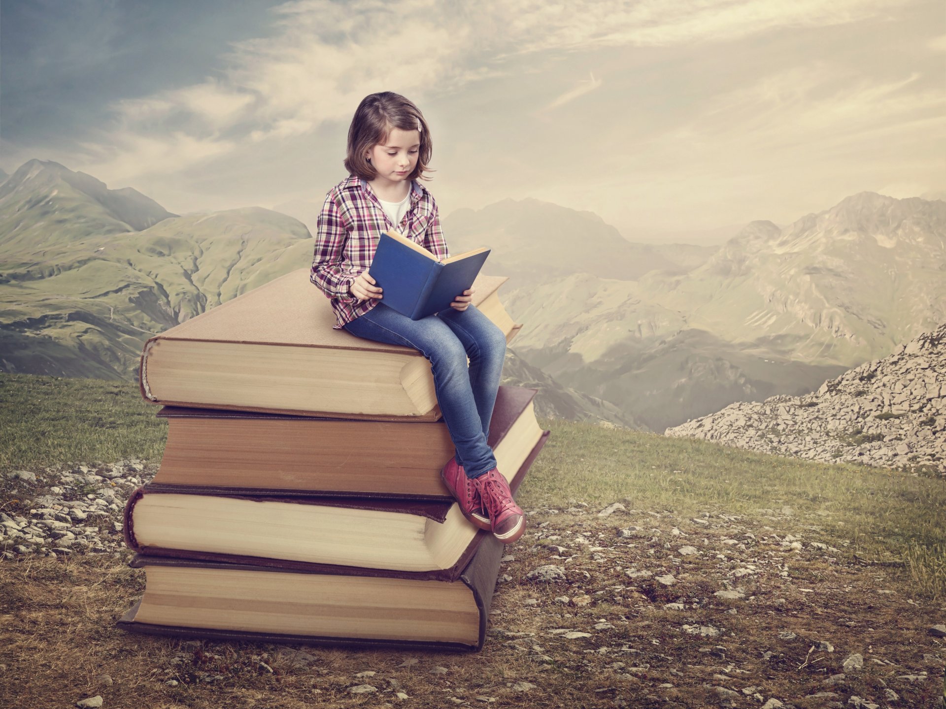 niña libros lectura montañas naturaleza