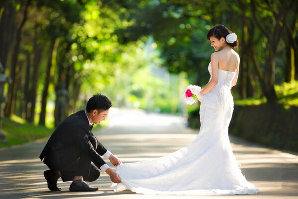 A girl in a wedding dress with a guy in a suit