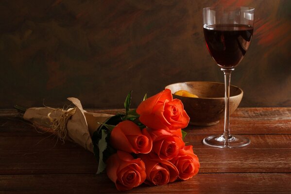 The guy is waiting for his mistress with a bouquet and wine