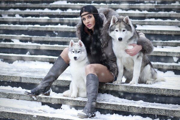 Husky e ragazza su sfondo invernale