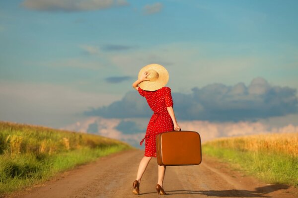 A traveler girl in a dress