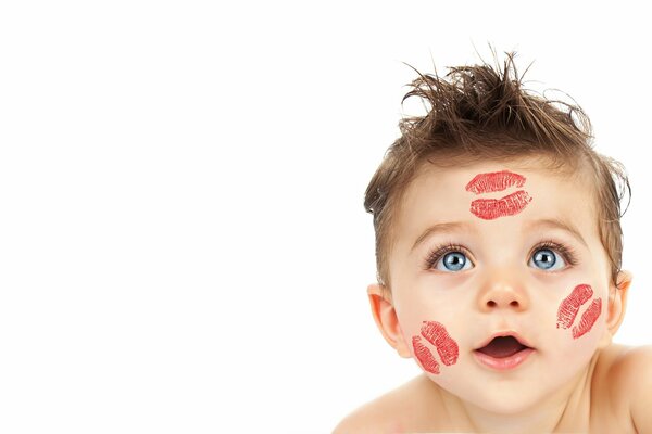 A boy with lipstick marks from kissing