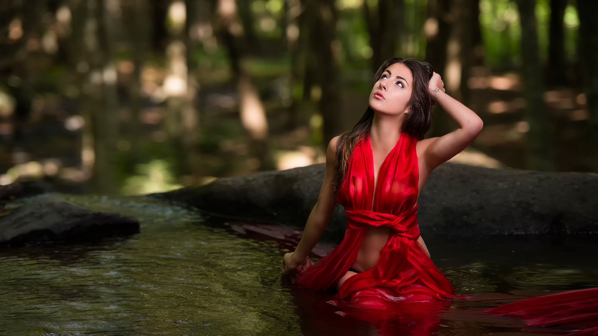 karolane in water in red