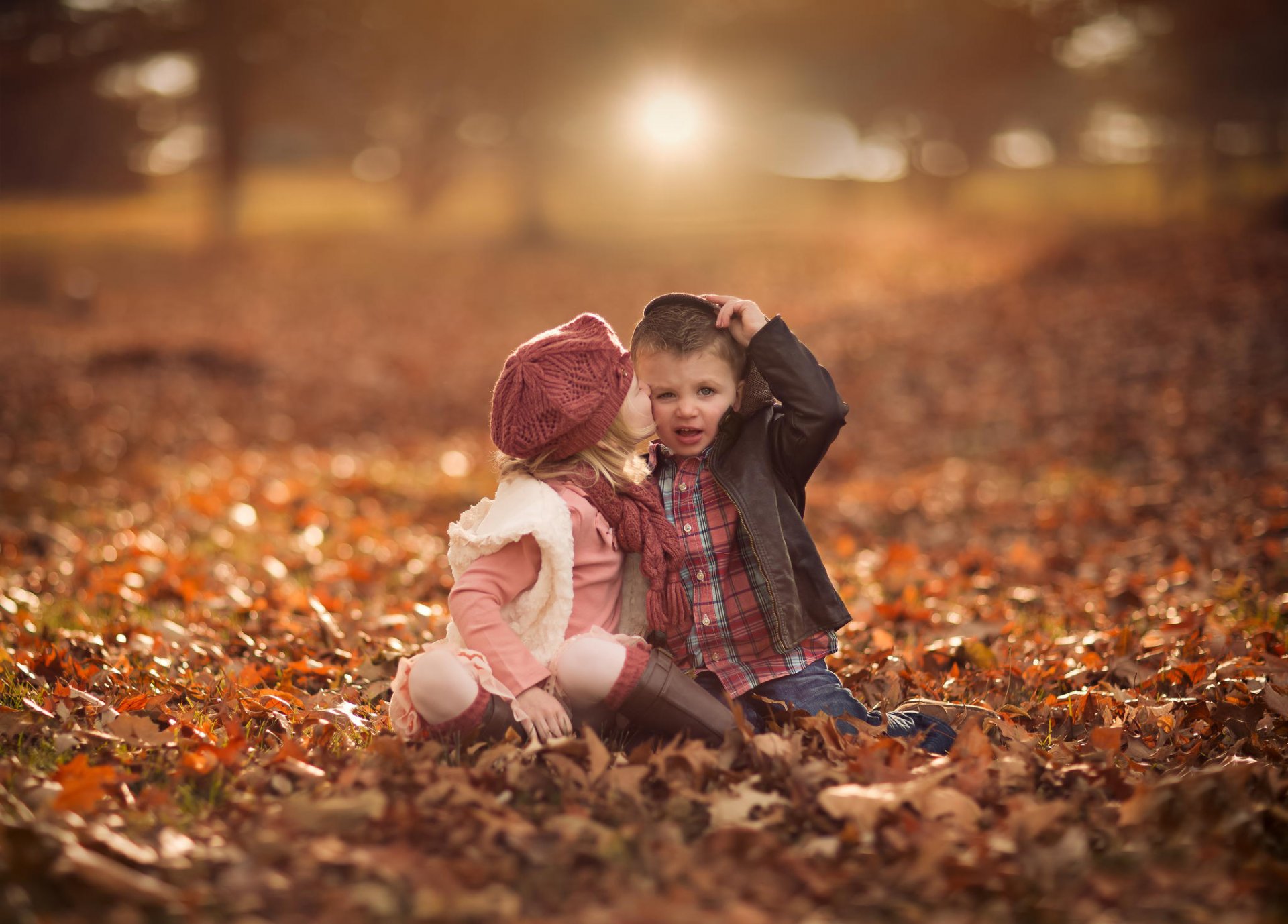 girl boys autumn leaves bokeh