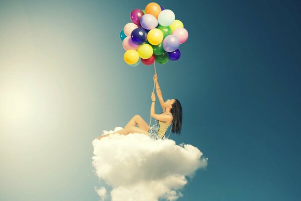 Girl on a cloud with a bouquet of balloons