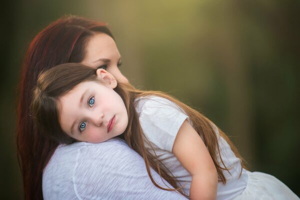 Mom with a little girl tenderness