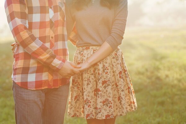 A guy holds a girl s hand