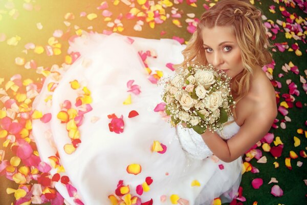 Pond girl in a wedding dress with a bouquet of flowers