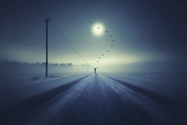 The road to the distance. A man on the background of fog