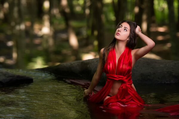 The girl in red in the water