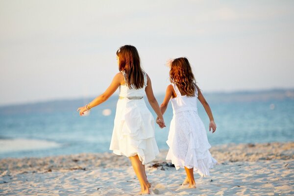 Girls in white on the seashore