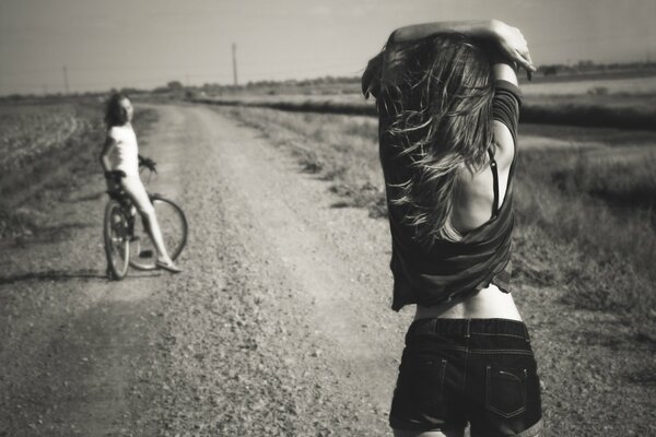 Black and white photo of a girl in summer in shorts