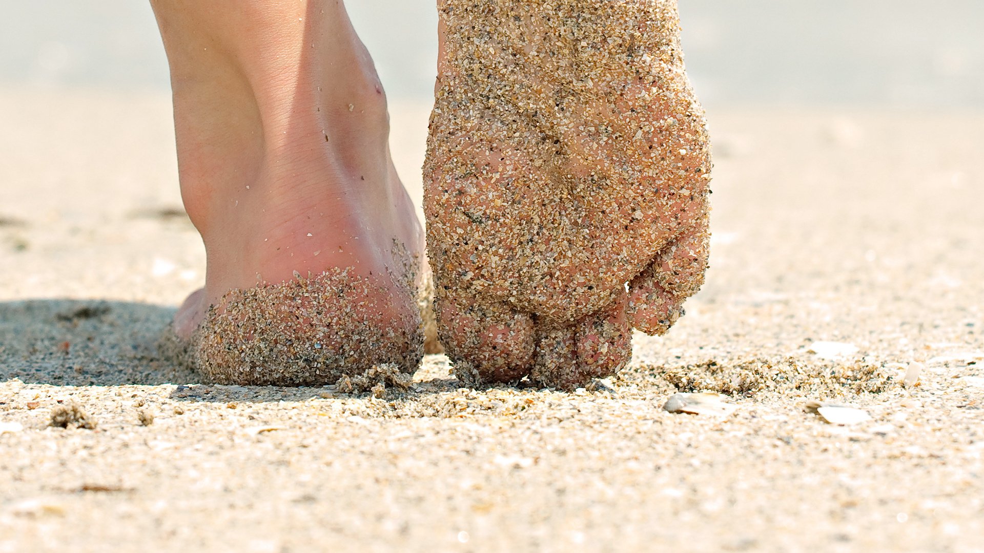 mood girl feet heel . sand. macro beach summer. sun background wallpaper