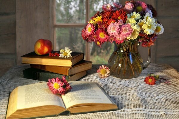 Still life bouquet of flowers and books