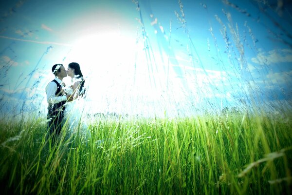 A kiss. Lovers on the background of sunrise