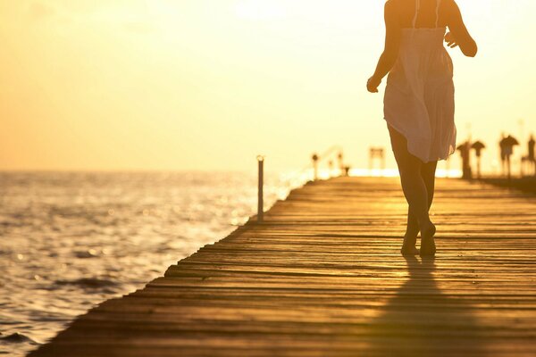 Interestingly focused image of a woman on the pier