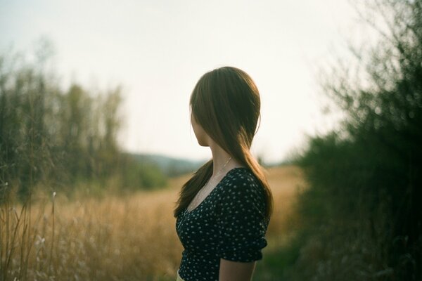 A girl in nature. Blurred background