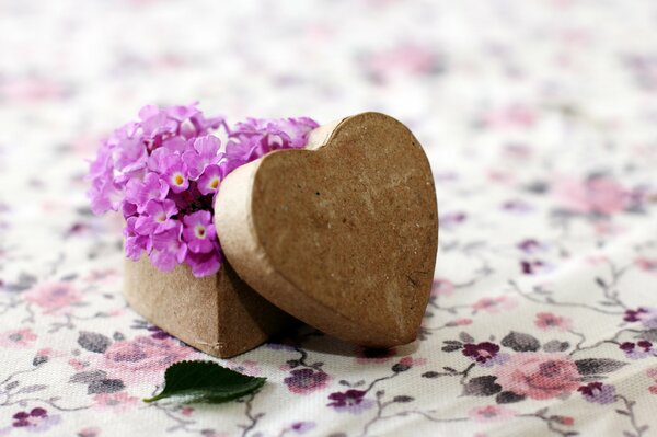 Valentine in a box in the form of a heart and flowers