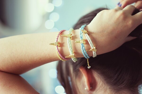 Bracelets with eiffel towers on a woman s hand