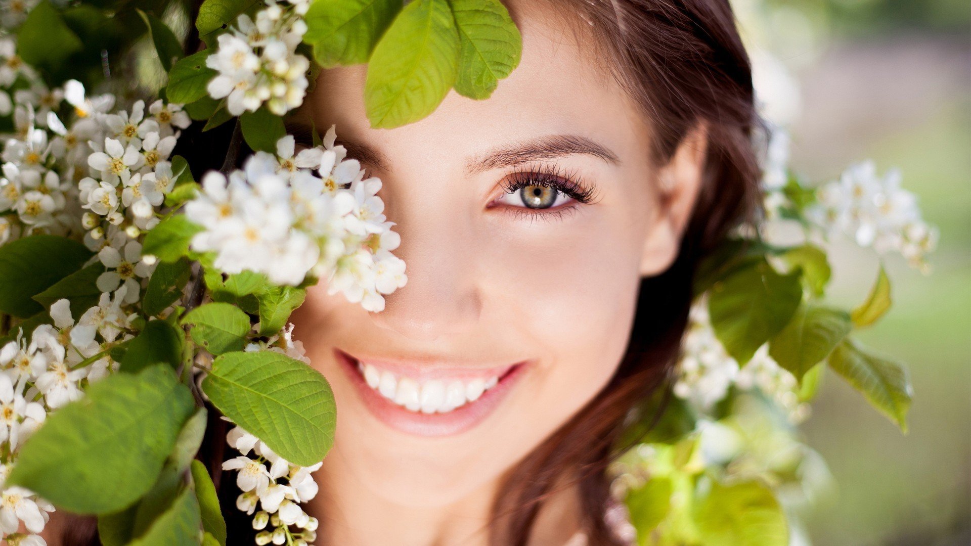 mood girl brunette face smile happiness eyes view laughter positive flower flowers leaves nature background wallpaper