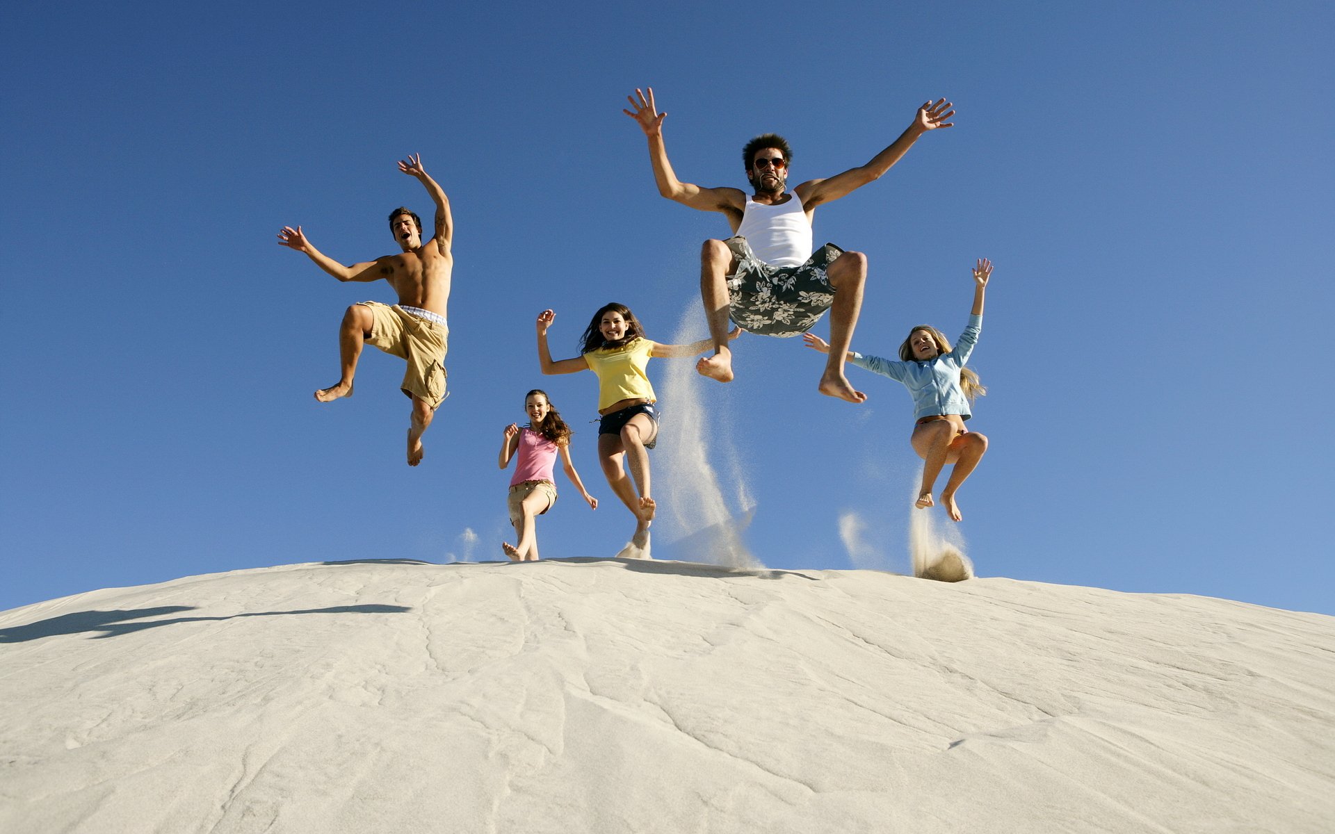 mood happiness joy jump sky sand guys girls summer laughter