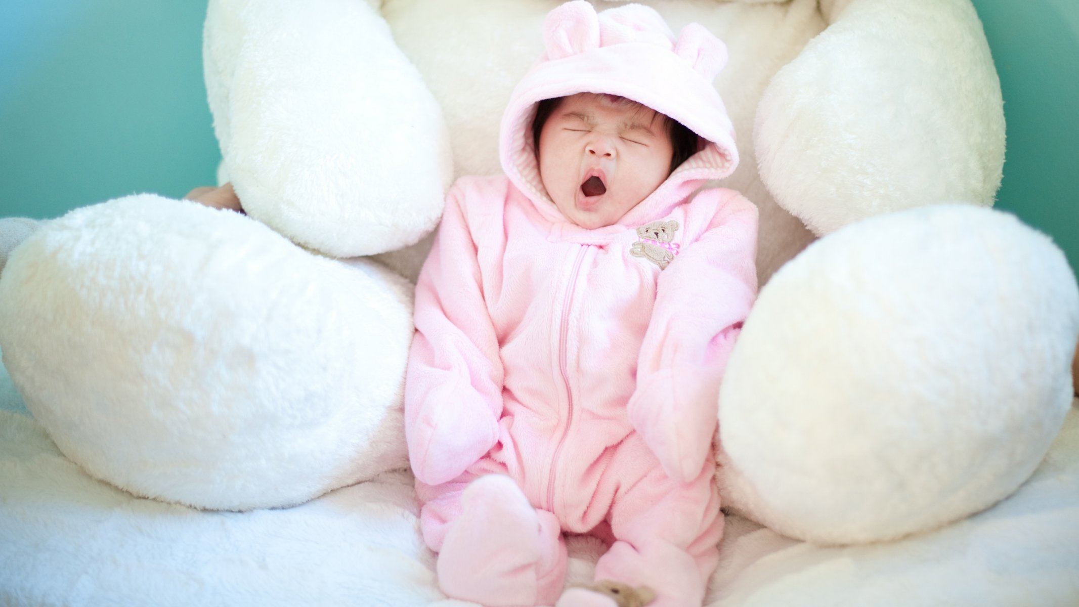 mood children child babe yawns form pink teddy bear toy. white. teddy soft background wallpaper