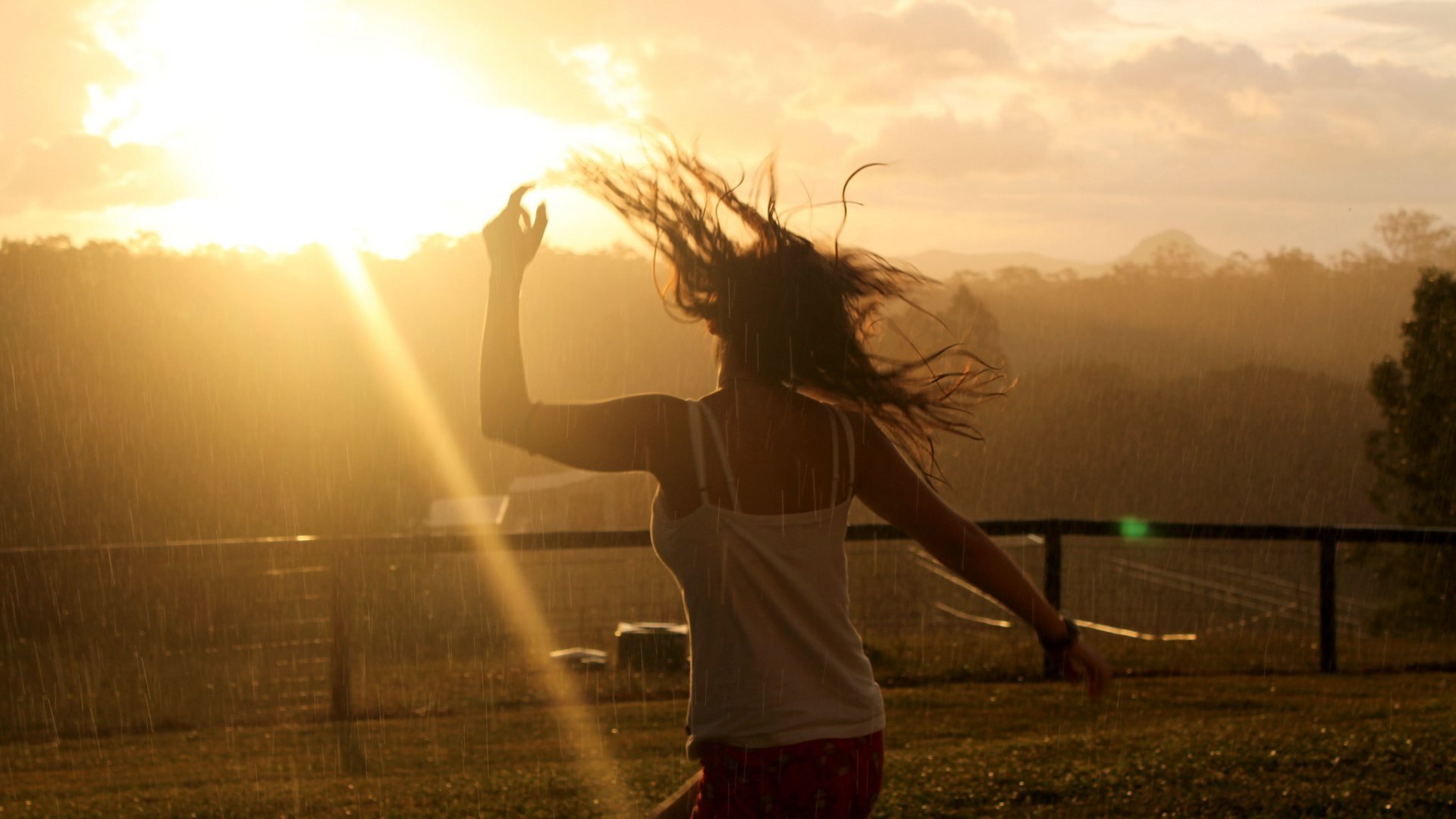 girl dance rain hair sun light fence sky tree