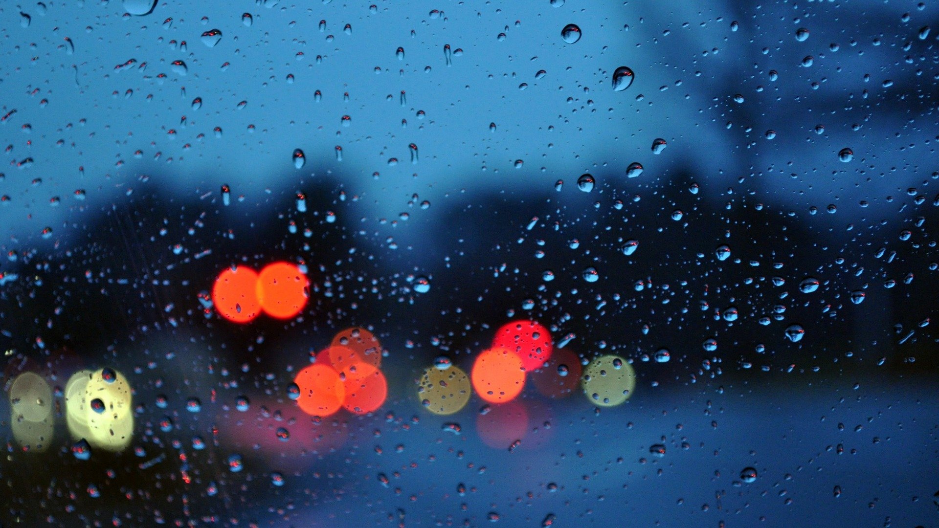 night town rain glass drops light lights bokeh mood