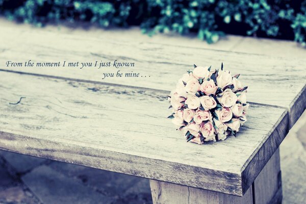 Bouquet of pink roses on the bench