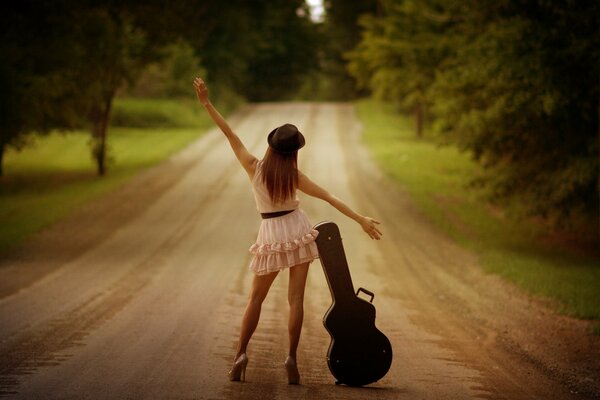 Girl with a case on the road