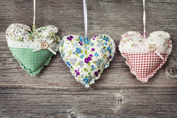 Three handmade heart-shaped pads