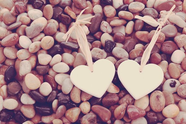 Hearts on the background of sea stones