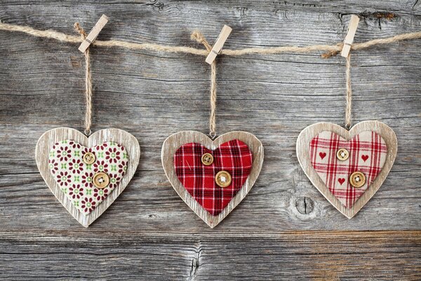 A heart on a rope with clothespins of happiness