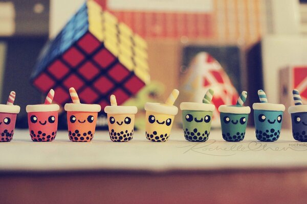 Positive toys. Cups with faces and tubes